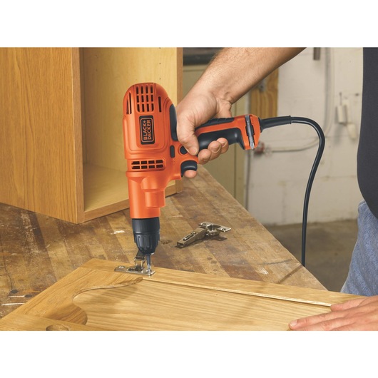 3 eighth inch Drill Driver with Storage Bag being used by a workman.
